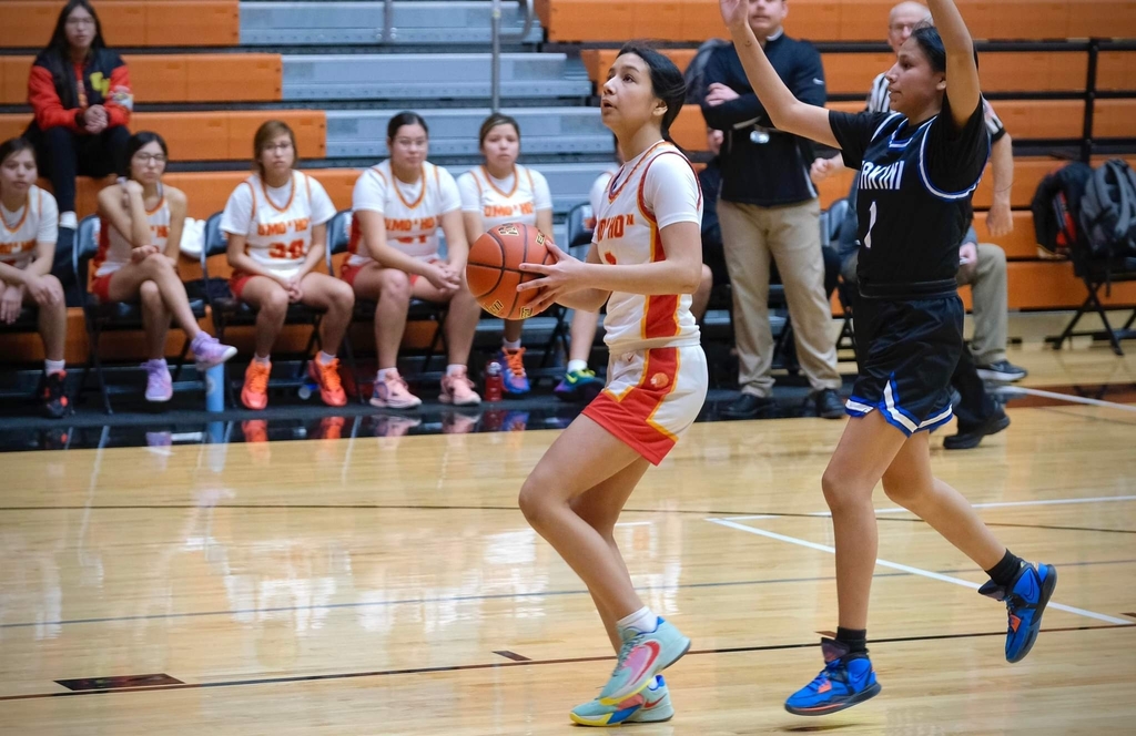 Latecia Contreras charges the basket.